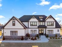 Charming two-story home featuring a striking Tudor design, complemented by well-manicured landscaping and a welcoming entrance at 3966 Chapel Hl Ct, Bargersville, IN 46106