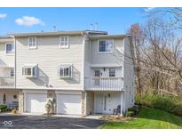 Charming townhome exterior boasts stone accents, private entrance, and attached garage at 6756 Shore Island Dr, Indianapolis, IN 46220