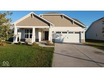 Charming single-Gathering home featuring a two-car garage and well-maintained front yard at 8105 Milender Blvd, Indianapolis, IN 46237