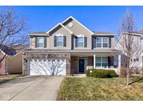Two-story home with a brick and siding exterior, attached two-car garage, and a well-maintained lawn at 15133 Brantley Ln, Noblesville, IN 46060