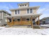 Charming two-story home featuring a spacious front porch and a classic design at 17 Parkview Ave, Indianapolis, IN 46201