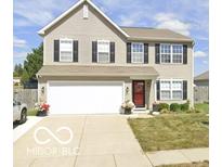 Charming two-story home with neutral siding, black shutters, and a well-manicured lawn at 2180 Quarter Path Rd, Cicero, IN 46034