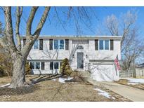 Charming two-story home with white siding, black shutters, and a well-manicured front yard at 3222 Wedgewood Dr, Indianapolis, IN 46227