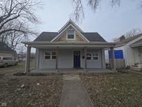 Charming one-story home with a covered front porch and welcoming facade at 952 N Concord St, Indianapolis, IN 46222