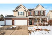 Charming two-story brick home with attached two-car garage and well-manicured front yard at 1226 Siena Dr, Greenwood, IN 46143