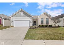Charming single-Gathering home featuring a two-car garage, well-kept lawn, and manicured landscaping at 12819 Bardolino Dr, Fishers, IN 46037