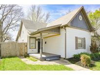 Charming single-Gathering home featuring a quaint front porch and well-maintained landscaping at 2014 Barth Ave, Indianapolis, IN 46203