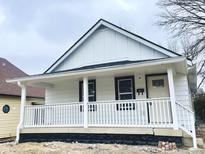 Charming renovated one-story home featuring a covered porch and fresh white exterior at 2137 Napoleon St, Indianapolis, IN 46203