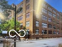 Exterior shot of a brick building with street access and some trees at 430 N Park Ave # 510, Indianapolis, IN 46202