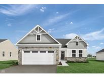 Charming single Gathering home with a two-car garage and stone veneer accents at 1202 Brightwood Cir, Greenfield, IN 46140