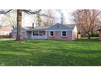 Charming single-story home with brick accents, a covered porch, and a lush front yard at 3121 W 13Th St, Anderson, IN 46011