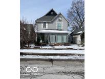 Charming two-story home features a welcoming front porch and classic architectural details at 926 River Ave, Indianapolis, IN 46221