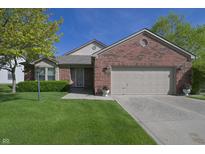 Charming brick home with a well-maintained lawn, attached garage, and beautiful landscaping at 1232 Severn Ct, Greenwood, IN 46142