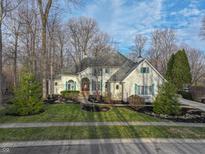 Charming home with a well-manicured front yard, lush landscaping, and beautiful curb appeal at 4388 Creekside Pass, Zionsville, IN 46077