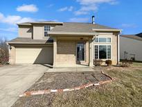 Charming two-story home with a well-maintained lawn and inviting entrance at 81 Stoneybrook Dr, Greenwood, IN 46142