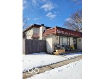 Modest home featuring a small porch area and red tiled roof, awaiting personal touches at 8353 Paso Del Norte Ct, Indianapolis, IN 46227