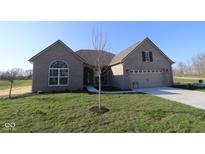 Charming single-story brick home with manicured lawn and inviting curb appeal on a clear day at 10502 Oak Bend Blvd, Indianapolis, IN 46239