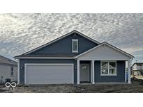 Charming blue single-Gathering home features an attached garage and covered front porch at 5146 Cartland Dr, Indianapolis, IN 46239