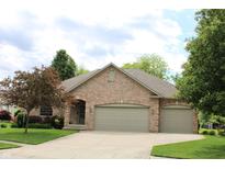 Charming single story brick home with an attached two car garage and beautifully maintained lawn at 11 Stratford Way, Danville, IN 46122