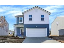 Charming two-story home with blue siding and a white garage door, offering a modern and inviting curb appeal at 11711 Cotterill Way, Indianapolis, IN 46235