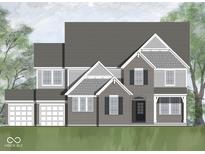 Charming two-story home features a brick facade, symmetrical design, and a well-manicured front lawn, creating a welcoming curb appeal at 16473 Valhalla Dr, Noblesville, IN 46060