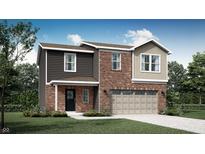 Charming two-story home featuring a brick and siding facade with a two-car garage at 2010 Foothill Dr, Greenfield, IN 46140