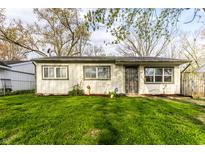 Attractive single-Gathering home showcasing a tidy front lawn and secure entrance at 3944 Strathmore Dr, Indianapolis, IN 46235