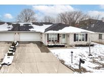 Charming single-story home with a white brick facade and a spacious driveway at 4501 N Wheeling Ave # 10A-101, Muncie, IN 47304
