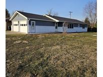 Charming home featuring an attached two-car garage, and a neatly maintained lawn at 4605 Southview Dr, Anderson, IN 46013