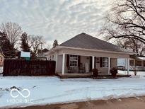 Charming single-story home with a covered front porch and neutral siding, perfect for relaxing outdoors at 609 Powell St, Lebanon, IN 46052