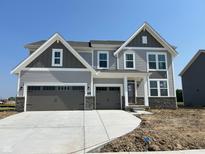 Beautiful two-story home with a three-car garage and stone accents at 640 Firefly Ct, Greenfield, IN 46140