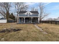 Charming two-story home with a covered front porch and inviting curb appeal at 7968 E 200 S, Whitestown, IN 46075