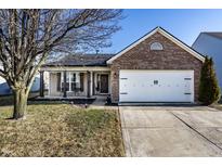 Charming single-Gathering home showcasing a brick facade and two-car garage at 3037 Knobstone Ln, Indianapolis, IN 46203