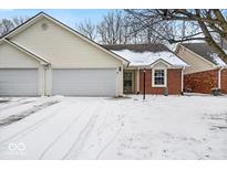 Charming home featuring brick accents, an attached two-car garage, and a neatly maintained lawn at 3843 Gray Pond Ct, Indianapolis, IN 46237