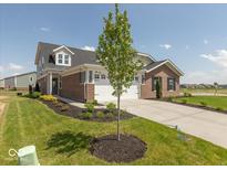 Charming brick and gray two-story home with a well-manicured lawn and a two-car garage at 7367 Broadview Ln, McCordsville, IN 46055