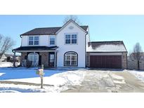 Charming two-story home with attached garage and well-maintained landscaping in a desirable neighborhood at 1403 Backwater Dr, Danville, IN 46122