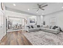 Spacious living room featuring hardwood floors and modern sectional sofa at 234 N State Ave, Indianapolis, IN 46201