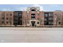 Attractive brick condo building with a modern design and beautifully landscaped grounds at 355 E Ohio St # 116, Indianapolis, IN 46204