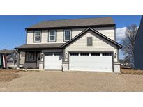 Two-story home featuring a two-car garage, gray siding, and an inviting front porch at 4396 Pine Bluff Dr, Bargersville, IN 46106