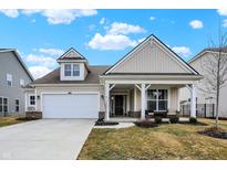 Charming home featuring neutral siding, a covered porch, and an attached two-car garage at 4425 Maize Ln, Whitestown, IN 46075