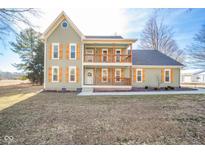 Charming front exterior with double porch and light green siding at 4981 E County Road 200 S, Avon, IN 46123