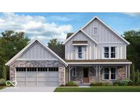 Charming two-story home featuring a brick and siding facade, attached garage, and well-manicured lawn at 618 Firefly Ct, Greenfield, IN 46140