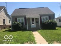 Charming single-story home with a well-maintained lawn, sidewalk, and neutral-colored siding at 713 N Cherry St, Columbus, IN 47201