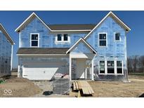 New two-story home featuring an attached two-car garage with professional building materials in a suburban neighborhood at 750 Oakleaf Dr, Greenfield, IN 46140