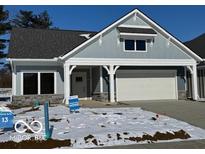 Charming single-story home with a covered entrance and attached garage, showcasing modern architectural details at 9124 Bryce Cir, Zionsville, IN 46077