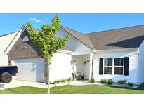 Charming one-story home with brick accent, attached garage, and manicured lawn at 10217 Caprock Canyon Dr, Indianapolis, IN 46229