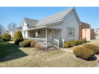 Charming home with a welcoming front porch and well-maintained landscaping at 234 S East St, Pendleton, IN 46064