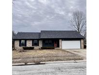Charming single story brick home with an attached two car garage and mature trees at 269 Heritage Dr, Danville, IN 46122
