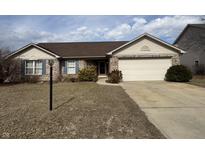 Charming single Gathering brick home with an attached garage, and neatly maintained lawn at 4946 Kilda Dr, Greenwood, IN 46142