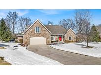 Charming brick home with a two-car garage and a well-manicured lawn in a desirable neighborhood at 8717 Vintner Ct, Indianapolis, IN 46256